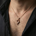 Load image into Gallery viewer, Rose gold plated shark necklace with sculpted predator form, detailed fin silhouette, and playful sea creature motif worn on the neck in a refined lifestyle shot with a warm and distinctive presentation
