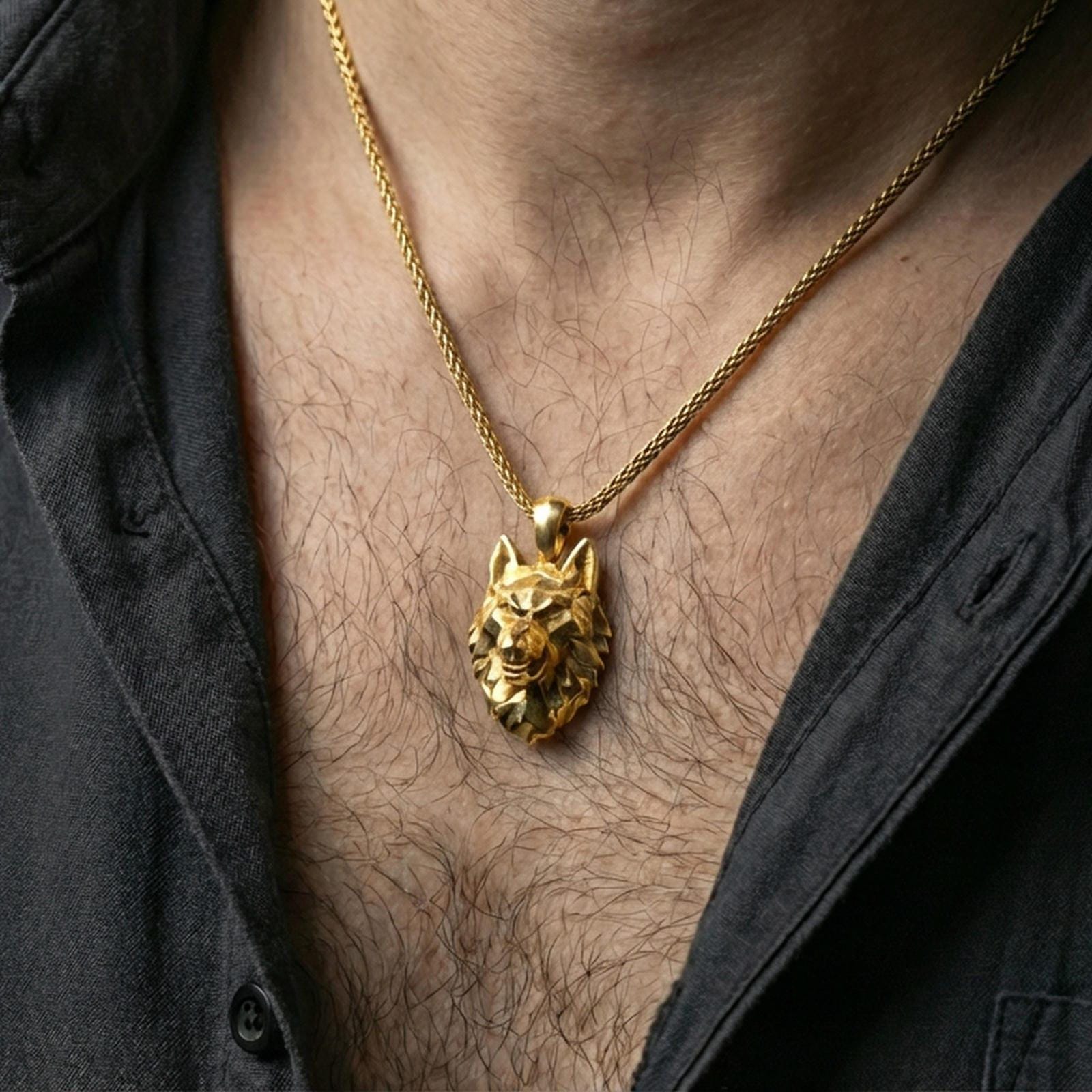 Gold plated polygonal wolf pendant with sharp geometric wolf face, faceted modern design, and spirit animal symbolism worn on the neck in a premium lifestyle composition with bold animal-inspired jewelry styling
