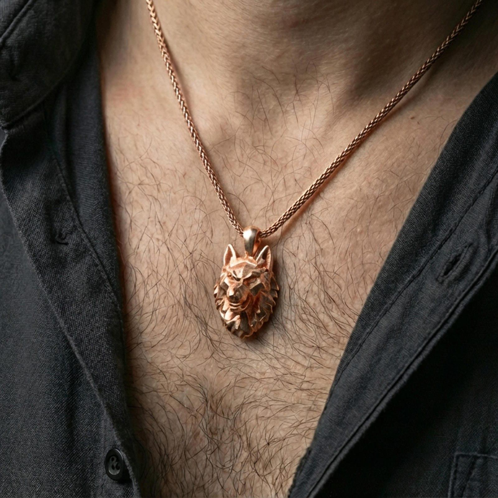 Rose gold plated geometric wolf necklace with low poly wolf head, angular faceted structure, and modern wilderness-inspired form worn on the neck in a refined lifestyle shot with a warm and sophisticated presentation