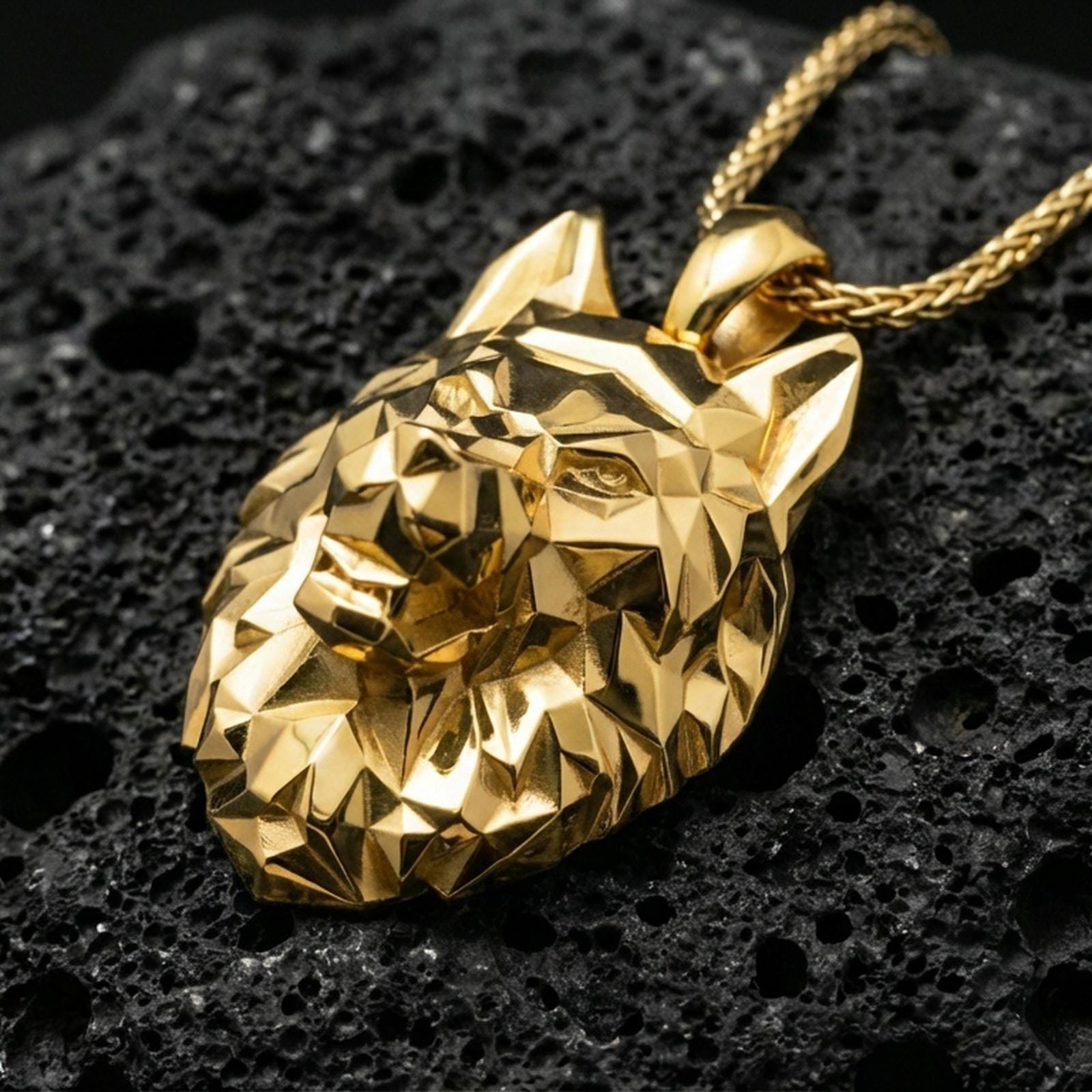 Gold plated polygonal wolf pendant with sculpted faceted wolf head, geometric angular detailing, and striking spirit animal silhouette showcased on black volcanic rock in a refined macro jewelry image