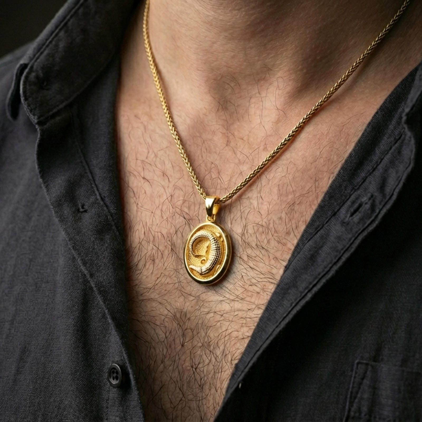 Gold plated crocodile pendant necklace worn on the neck, styled on a human model in a premium dark-toned lifestyle frame.