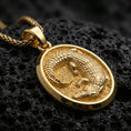 Load image into Gallery viewer, Gold plated crocodile pendant necklace displayed on porous volcanic rock, highlighted in a refined close-up jewelry photograph.
