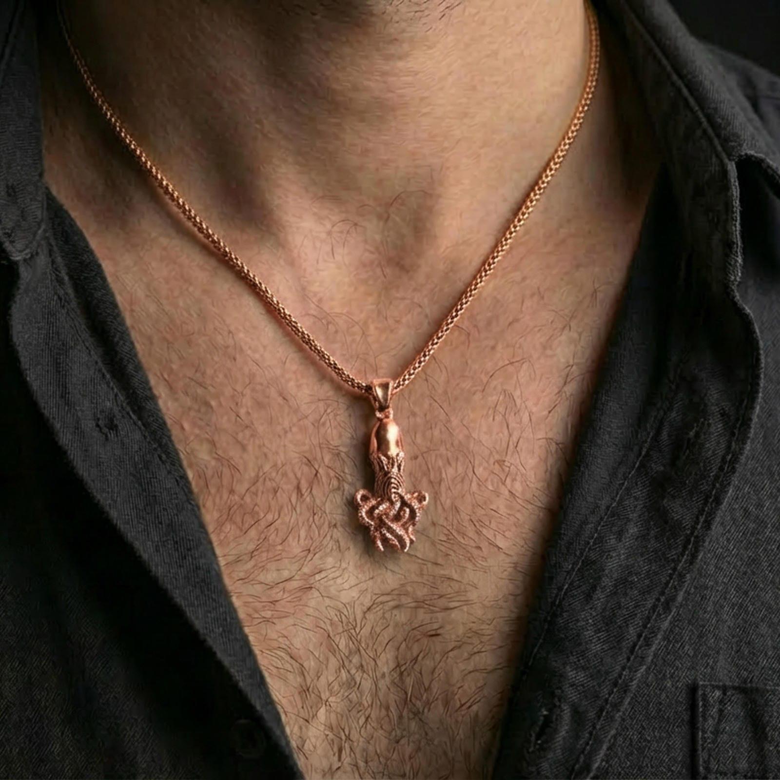 Rose gold plated octopus pendant necklace worn on the neck, presented in a close-up lifestyle shot with a refined masculine aesthetic.