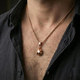 Load image into Gallery viewer, Rose gold plated origami tortoise pendant necklace worn on the neck, presented in a close-up lifestyle shot with a refined masculine aesthetic.
