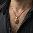 Load image into Gallery viewer, Rose gold plated tiger lion pendant necklace worn on the neck, presented in a close-up lifestyle shot with a refined masculine aesthetic.
