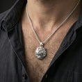 Load image into Gallery viewer, Polished silver tiger lion pendant necklace worn on the neck, shown against the chest in a clean and elegant everyday wear composition.
