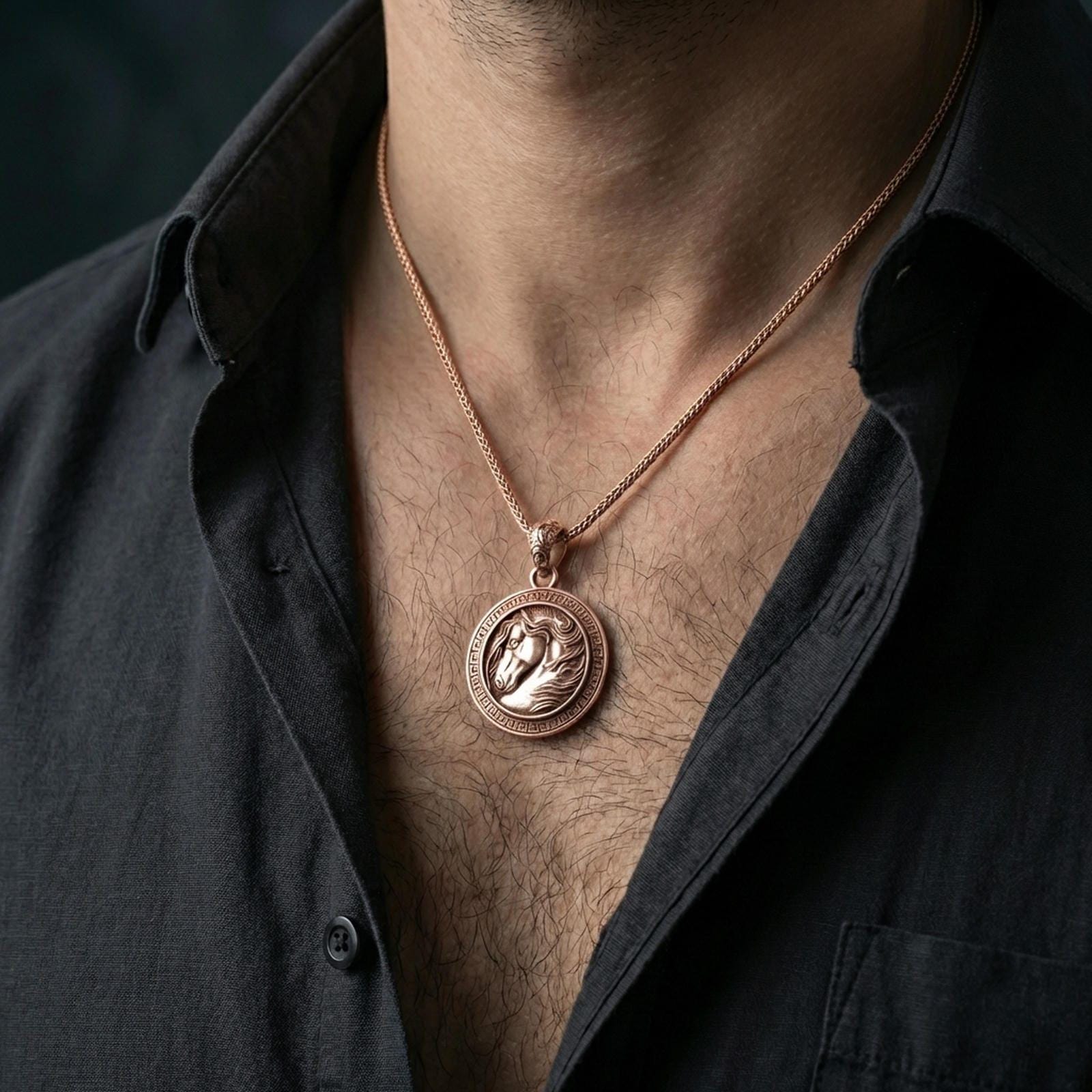 Rose gold plated horse head pendant necklace worn on the neck, presented in a close-up lifestyle shot with a refined masculine aesthetic.
