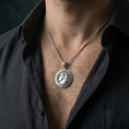 Load image into Gallery viewer, Polished silver horse head pendant necklace worn on the neck, shown against the chest in a clean and elegant everyday wear composition.
