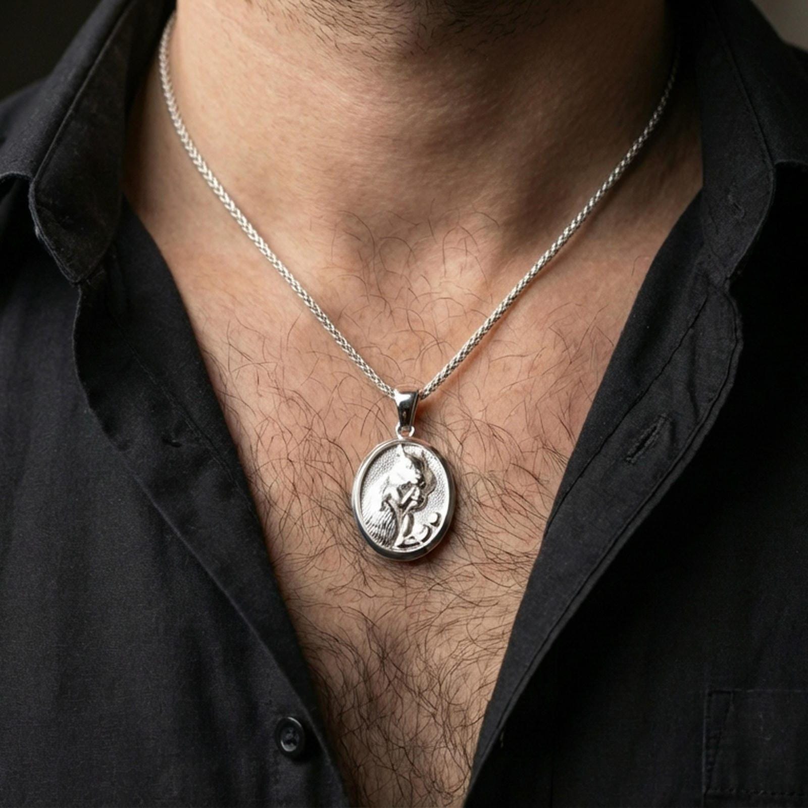 Polished silver squirrel pendant necklace worn on the neck, shown against the chest in a clean and elegant everyday wear composition.