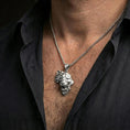 Load image into Gallery viewer, Polished silver lion head pendant necklace worn on the neck, shown against the chest in a clean and elegant everyday wear composition.
