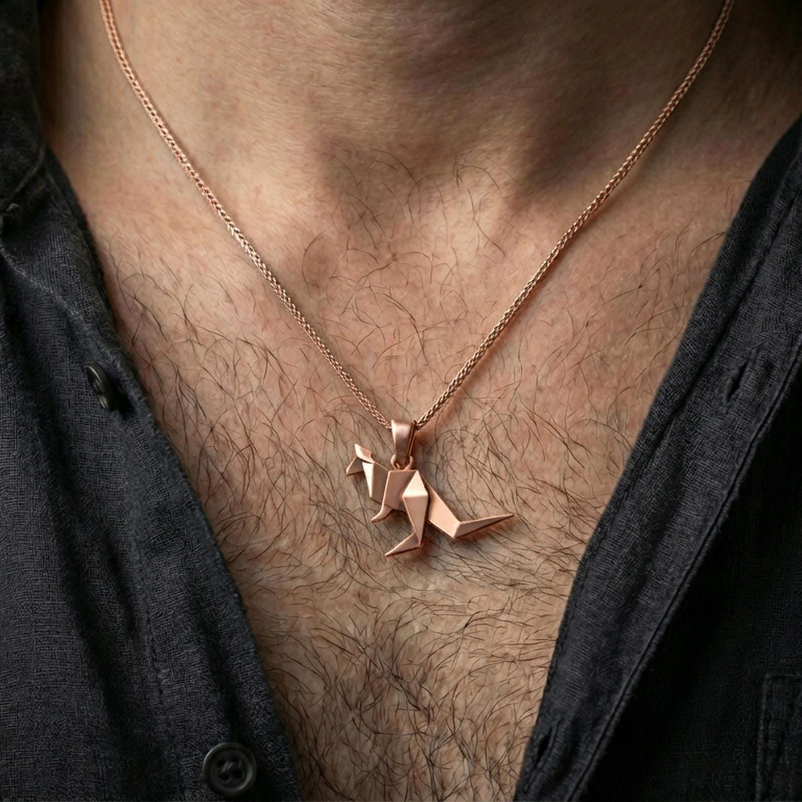 Rose gold plated origami kangaroo pendant necklace worn on the neck, presented in a close-up lifestyle shot with a refined masculine aesthetic.