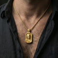 Load image into Gallery viewer, Gold plated Virgin Mary necklace with framed holy portrait worn on the neck in a premium lifestyle composition with classic Christian jewelry styling
