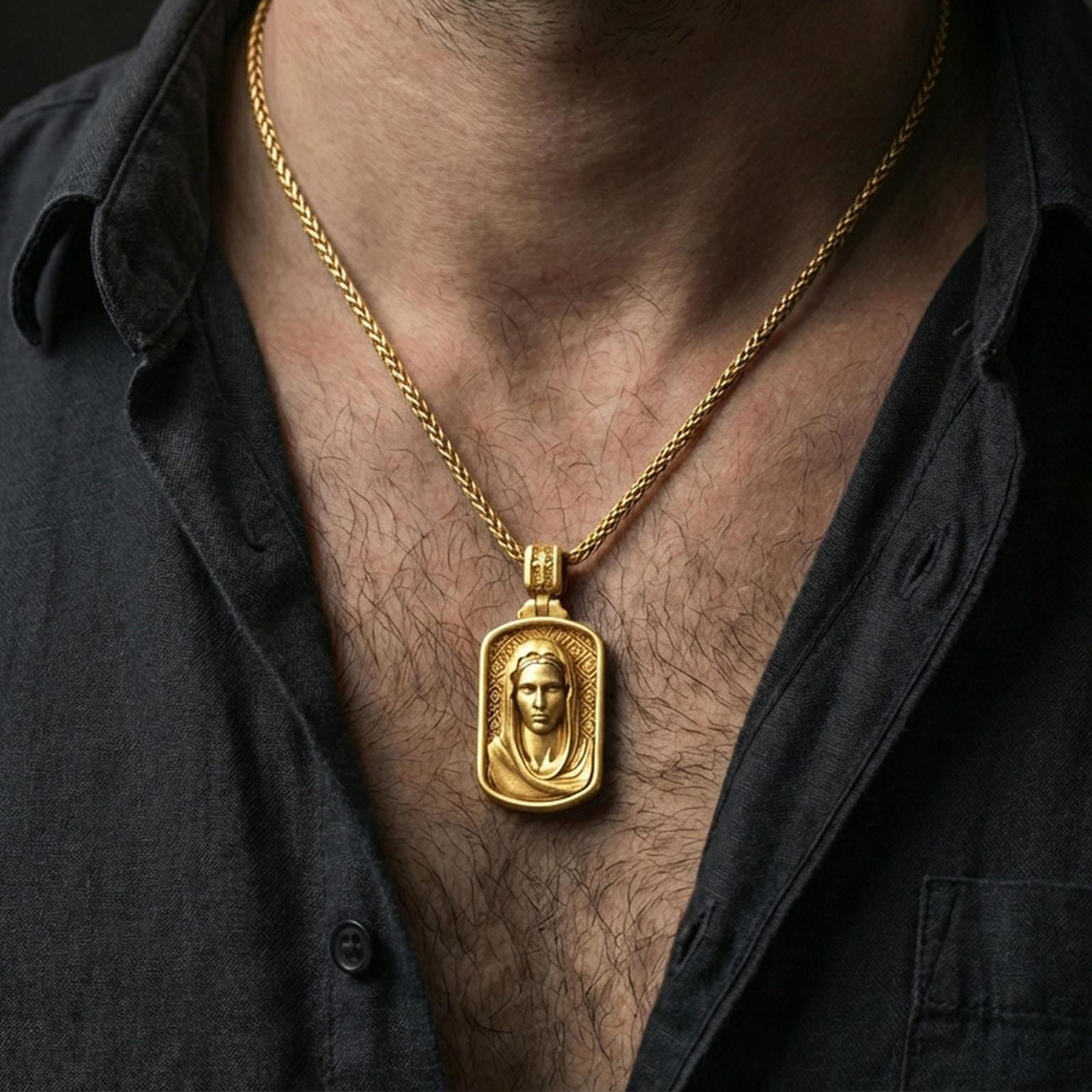 Gold plated Virgin Mary necklace with framed holy portrait worn on the neck in a premium lifestyle composition with classic Christian jewelry styling