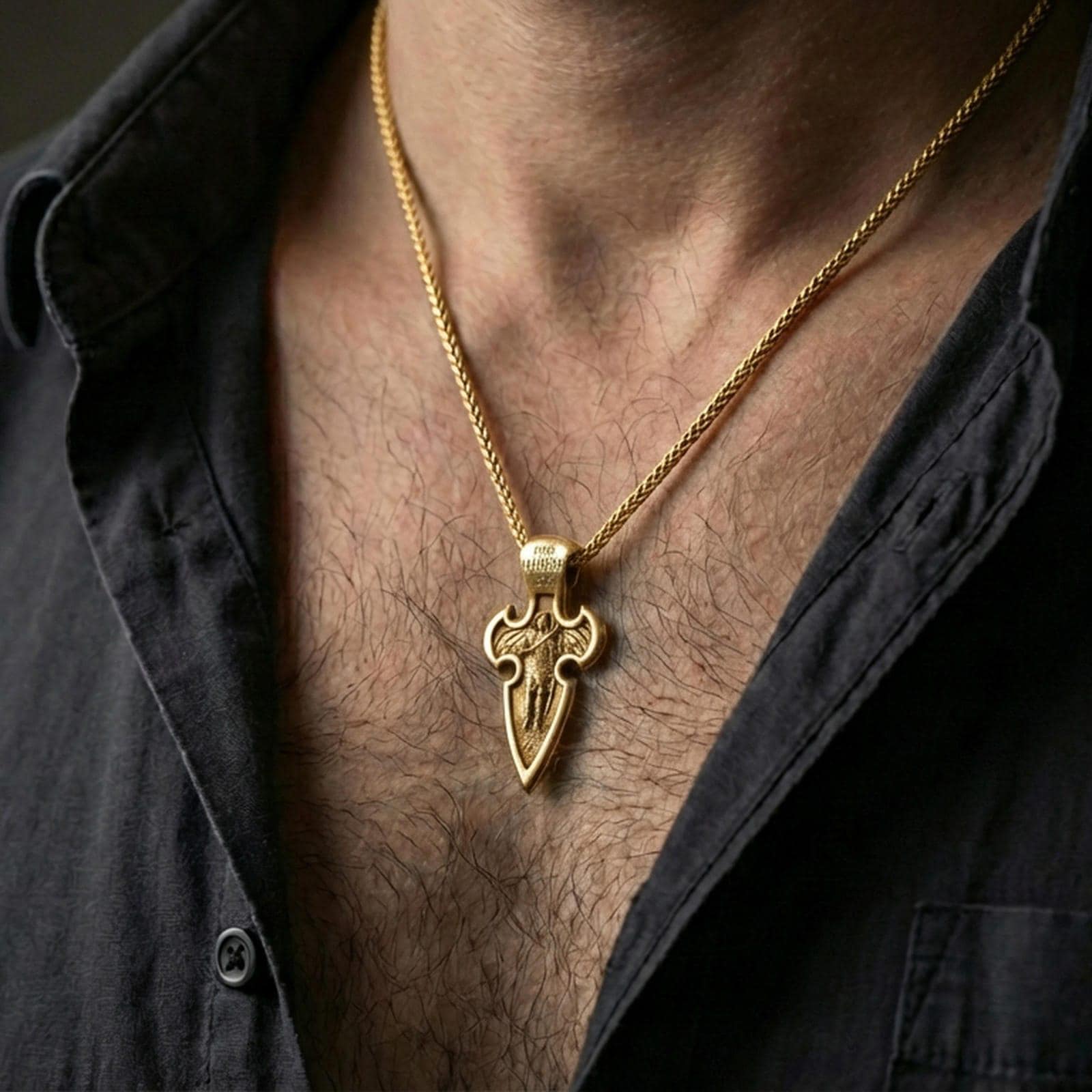 Gold plated Saint Michael pendant with winged protector motif worn on the neck in a premium lifestyle composition with strong Christian jewelry styling