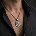 Load image into Gallery viewer, Polished silver Knights Templar seal pendant necklace worn on the neck, shown against the chest in a clean and elegant everyday wear composition.
