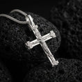 Load image into Gallery viewer, Polished silver Orthodox cross pendant necklace displayed on black volcanic rock, shown in a refined macro product shot with detailed crucifix figure and Slavonic inscription accents.
