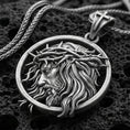 Load image into Gallery viewer, Oxidized Jesus crown of thorns pendant with side profile portrait and flowing hair detail displayed on dark volcanic rock in a close-up luxury jewelry composition
