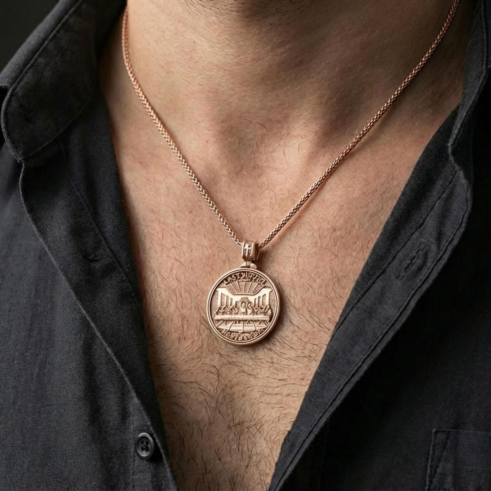 Rose gold plated round devotional pendant with Last Supper motif and Lord’s Prayer inscription worn on the neck in a refined lifestyle shot with a warm and elegant presentation