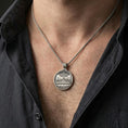 Load image into Gallery viewer, Oxidized Last Supper pendant with two-sided devotional design worn on the neck in a lifestyle jewelry shot, styled against the chest for a bold and faith-centered look

