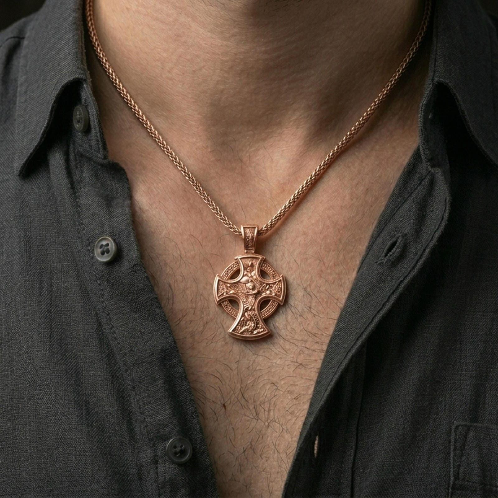 Rose gold plated Archangel Michael amulet with elaborate devotional cross design worn on the neck in a refined lifestyle shot with a warm and powerful presentation