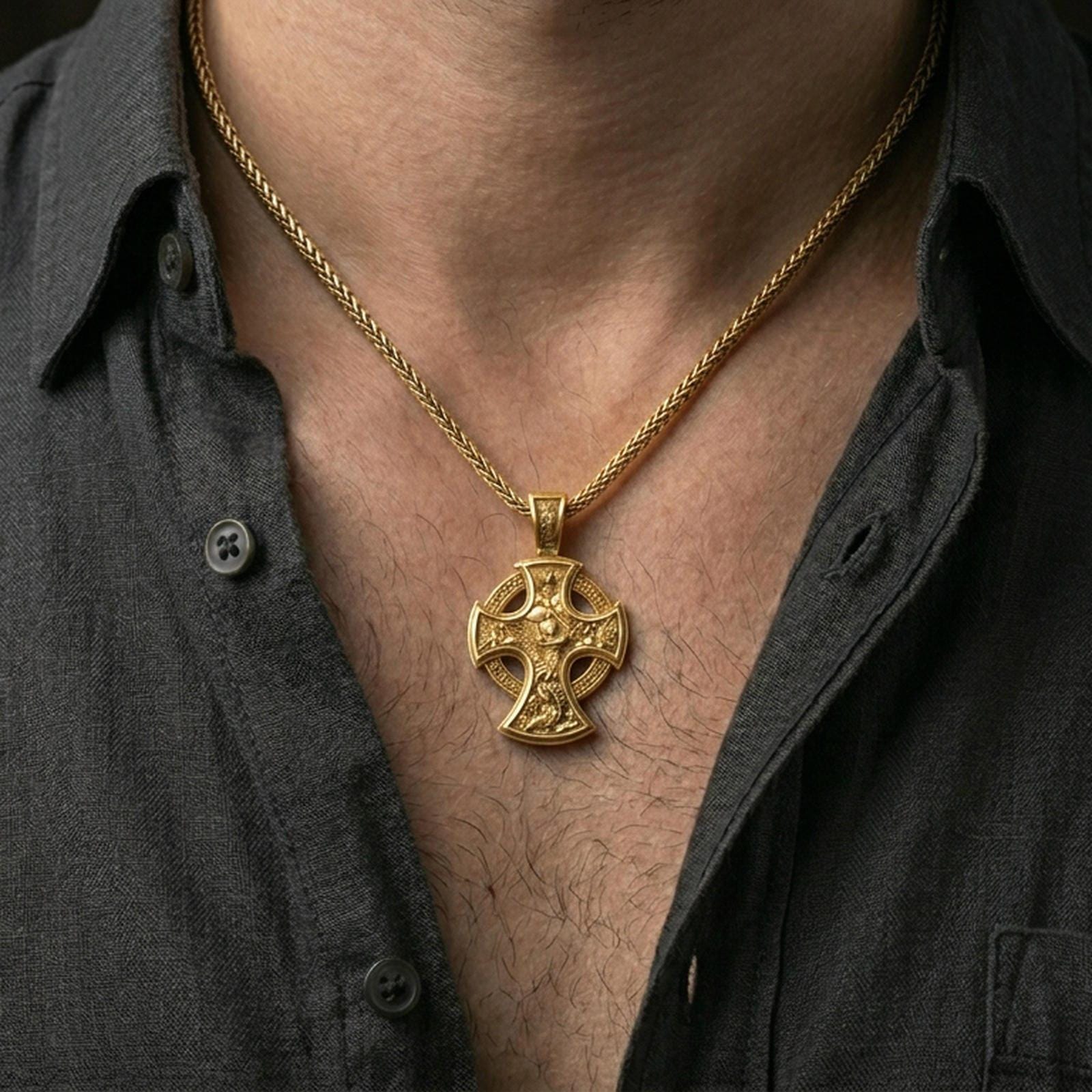 Gold plated Saint Michael cross necklace with angel warrior motif worn on the neck in a premium lifestyle composition with strong Christian jewelry styling