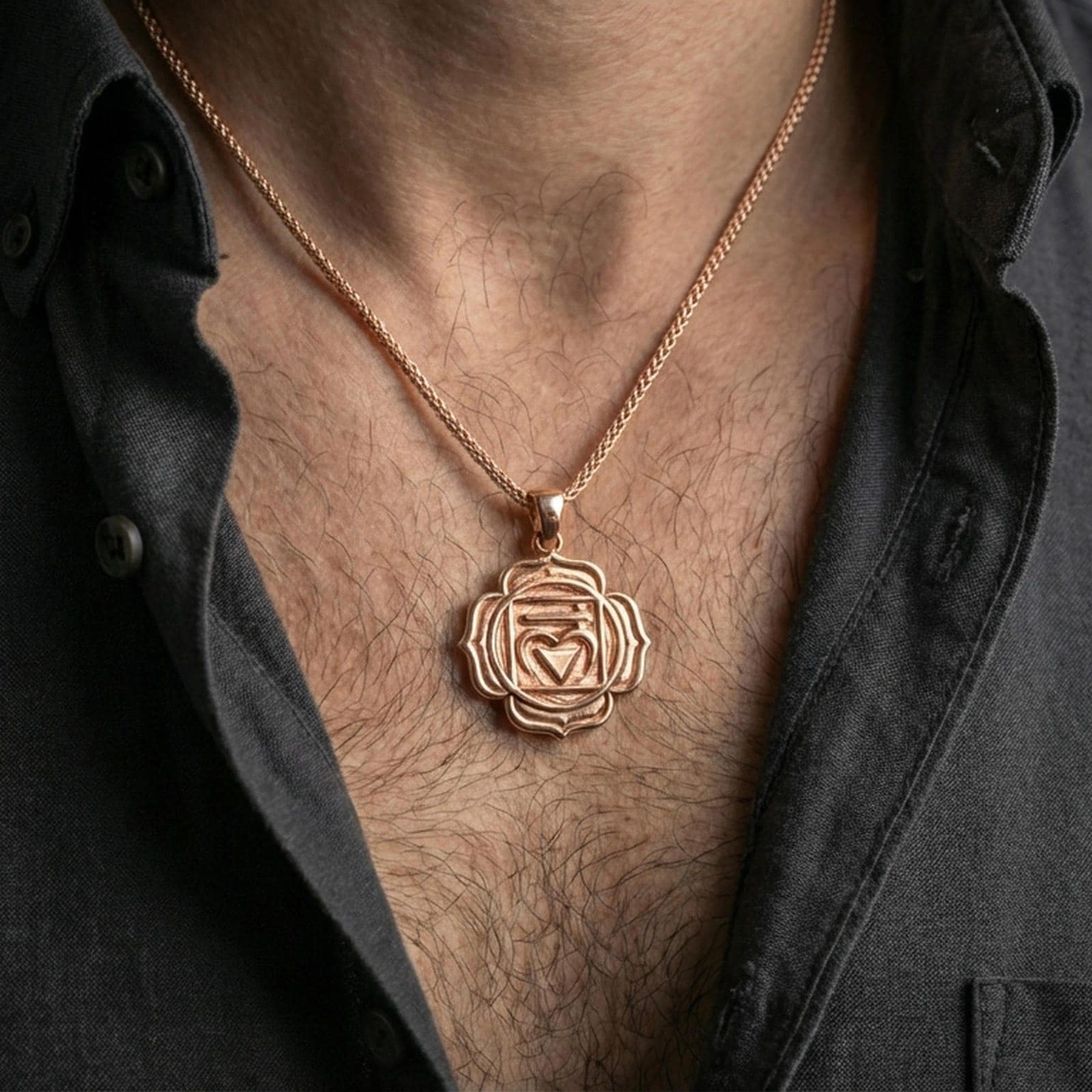 Rose gold plated spiritual chakra pendant with geometric heart chakra symbol and layered floral border worn on the neck in a refined lifestyle shot with a warm and balanced presentation