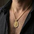 Load image into Gallery viewer, Gold plated Saint Paul necklace with devotional saint figure and sword symbol worn on the neck in a premium lifestyle composition with classic Christian jewelry styling
