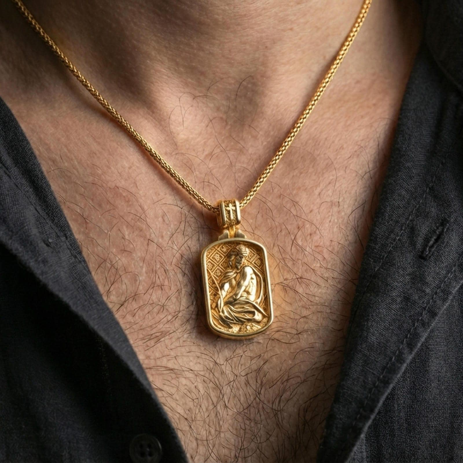 Gold plated Jesus Christ necklace with seated devotional figure and crown of thorns worn on the neck in a premium lifestyle composition with timeless Christian jewelry styling