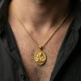Load image into Gallery viewer, Gold plated Saint Joseph necklace with Child Jesus figure and Catholic symbolism worn on the neck in a premium lifestyle composition with classic Christian jewelry styling
