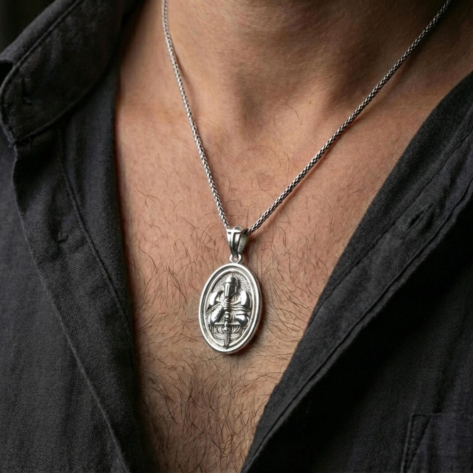 Polished silver crusader necklace with knight helmet relief and sword detail worn on the neck in a close lifestyle frame, highlighting the rotating oval design and warrior symbolism