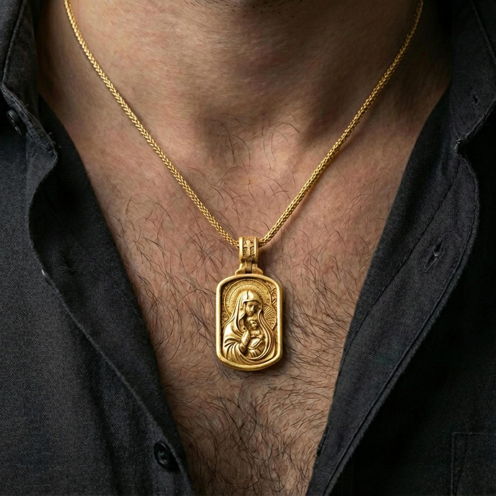Gold plated Virgin Mary necklace with Baby Jesus motif worn on the neck in a premium lifestyle composition with classic Christian jewelry styling