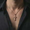 Load image into Gallery viewer, Rose gold plated Jesus Ascension cross pendant necklace worn on the neck, presented in a close-up lifestyle shot with a refined masculine aesthetic.
