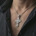 Load image into Gallery viewer, Polished silver Orthodox cross pendant necklace worn on the neck, shown against the chest in a clean and elegant everyday wear composition.

