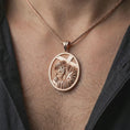 Load image into Gallery viewer, Rose gold plated Jesus carrying cross pendant necklace worn on the neck, presented in a close-up lifestyle shot with a refined masculine aesthetic.
