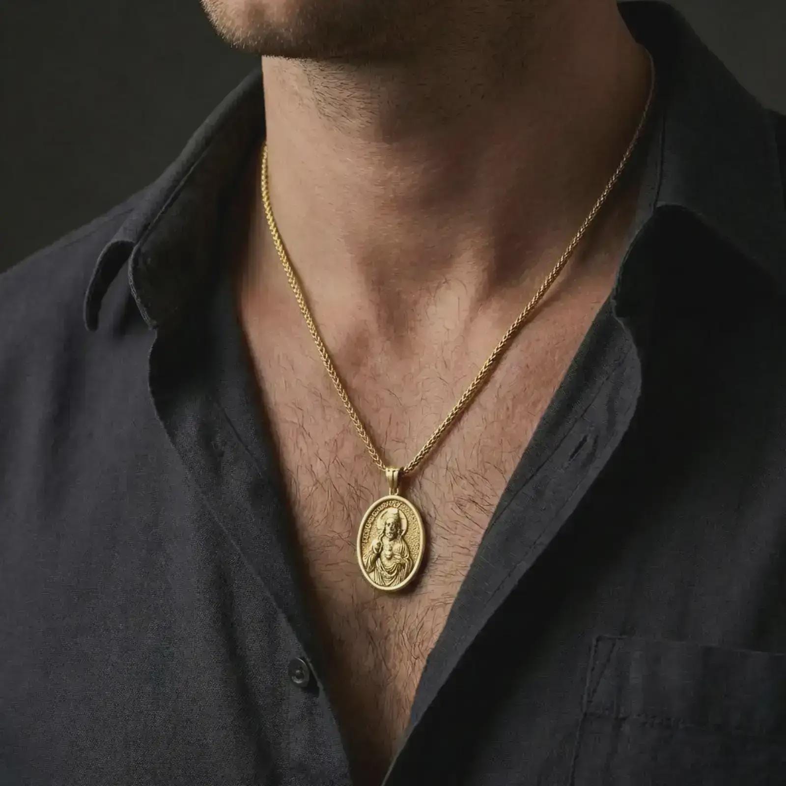 Gold plated Jesus Christ pendant necklace worn on the neck, captured on a human model in a premium dark-toned lifestyle frame.