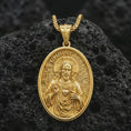 Load image into Gallery viewer, Gold plated Jesus Christ pendant necklace presented on porous volcanic rock, highlighting the oval medallion form and devotional heart motif in a luxurious close-up jewelry image.
