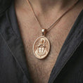 Load image into Gallery viewer, Rose gold plated Saint Michael Archangel pendant necklace worn on the neck, presented in a close-up lifestyle shot with a refined masculine aesthetic.
