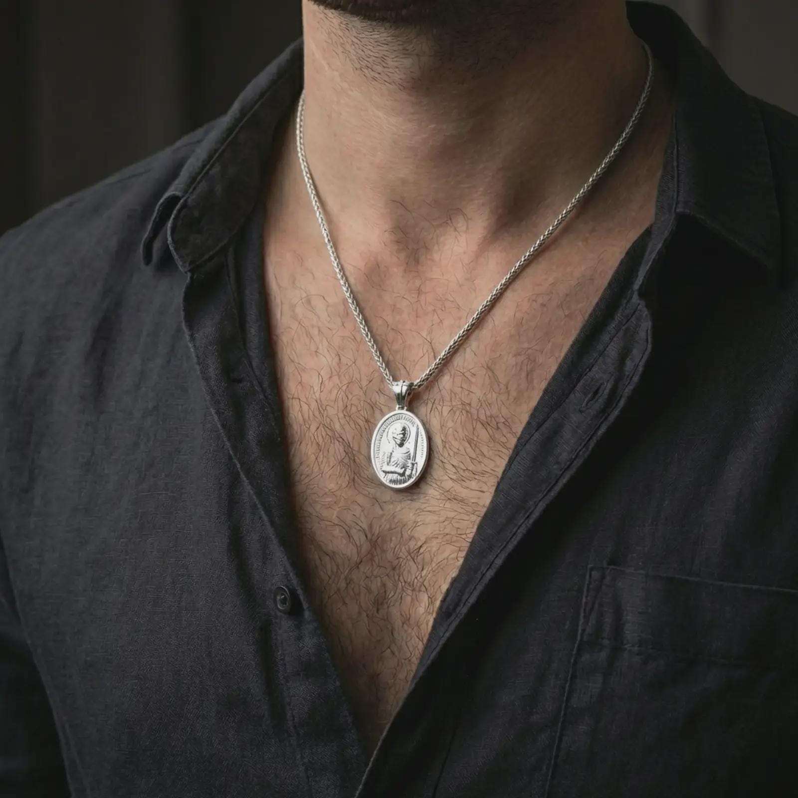 Polished silver Saint Martin of Tours pendant necklace worn on the neck, shown against the chest in a clean and elegant everyday wear composition.