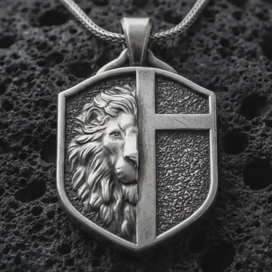 A 925 sterling silver lion cross shield pendant on black volcanic stone with oxidized depth and strong relief details.