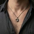 Load image into Gallery viewer, Oxidized crocodile pendant worn on the neck in a lifestyle jewelry shot, styled against the chest for a bold and distinctive statement look
