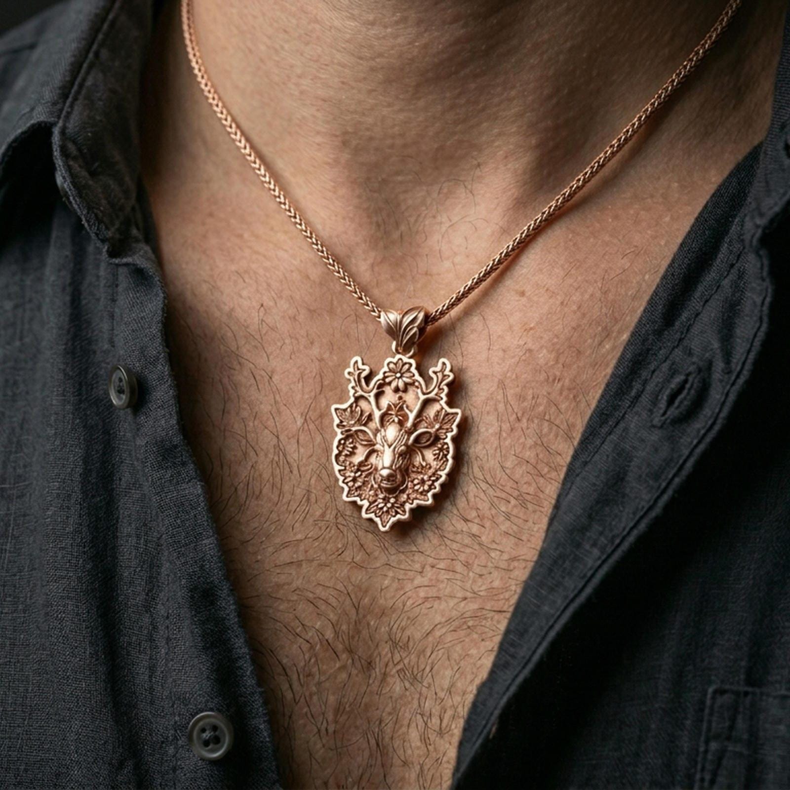 Rose gold plated stag pendant with flower-adorned antlers and artistic forest detailing worn on the neck in a refined lifestyle shot with a warm and elegant presentation