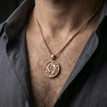 Load image into Gallery viewer, Rose gold plated yin yang koi necklace with flowing aquatic details and circular fish motif worn on the neck in a refined lifestyle shot with a warm and harmonious presentation
