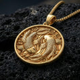 Load image into Gallery viewer, Gold plated koi fish pendant with twin swimming fish, round medallion form, and elegant water-and-lotus-inspired detailing showcased on black volcanic rock in a refined macro jewelry image

