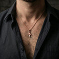 Load image into Gallery viewer, Rose gold plated origami parrot necklace with sleek geometric bird design worn on the neck in a refined lifestyle shot with a warm and elegant presentation
