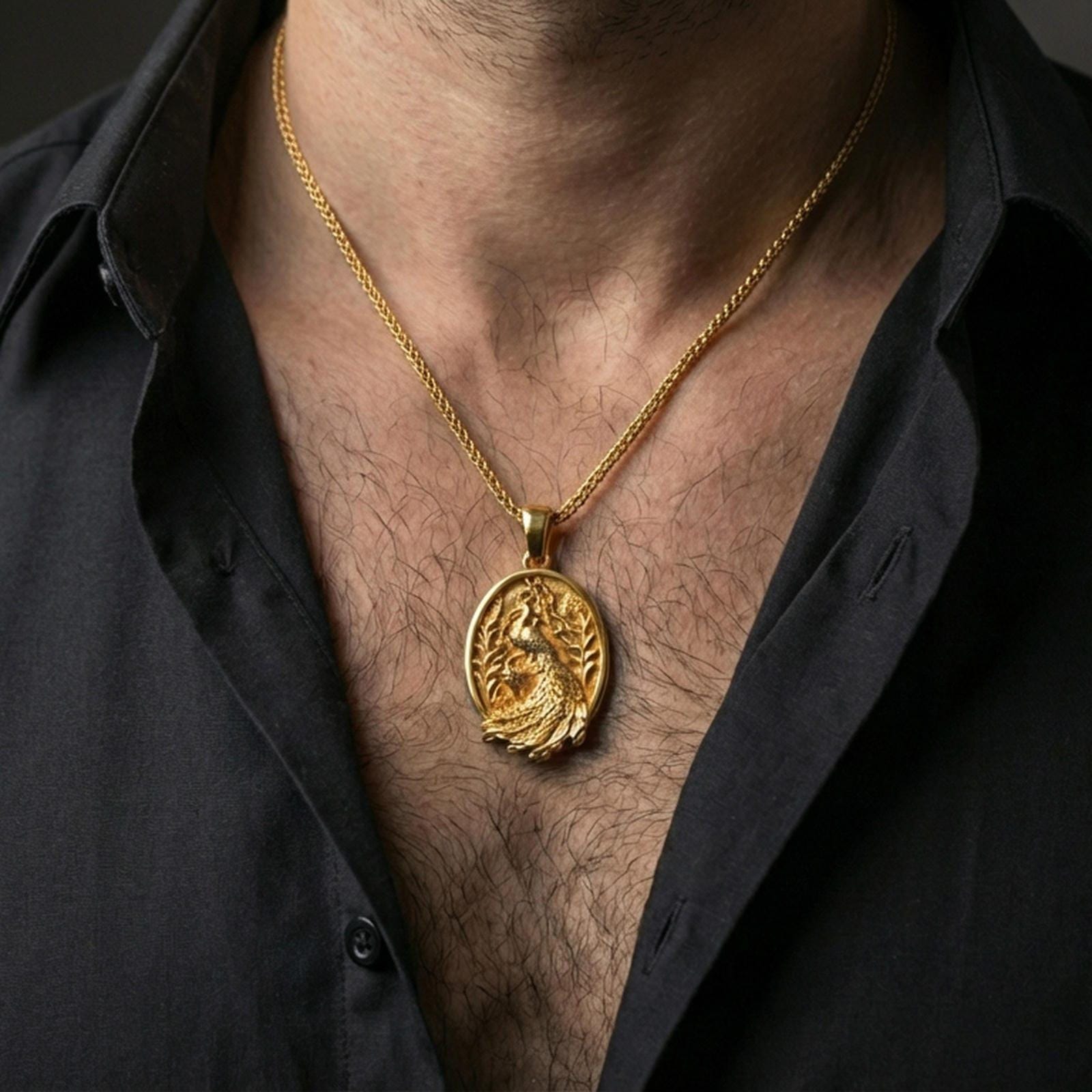 Gold plated peacock pendant with decorative feather design and botanical motifs worn on the neck in a premium lifestyle composition with refined animal jewelry styling