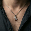 Load image into Gallery viewer, Oxidized origami rabbit pendant worn on the neck in a lifestyle jewelry shot, styled against the chest for a bold and minimalist statement look
