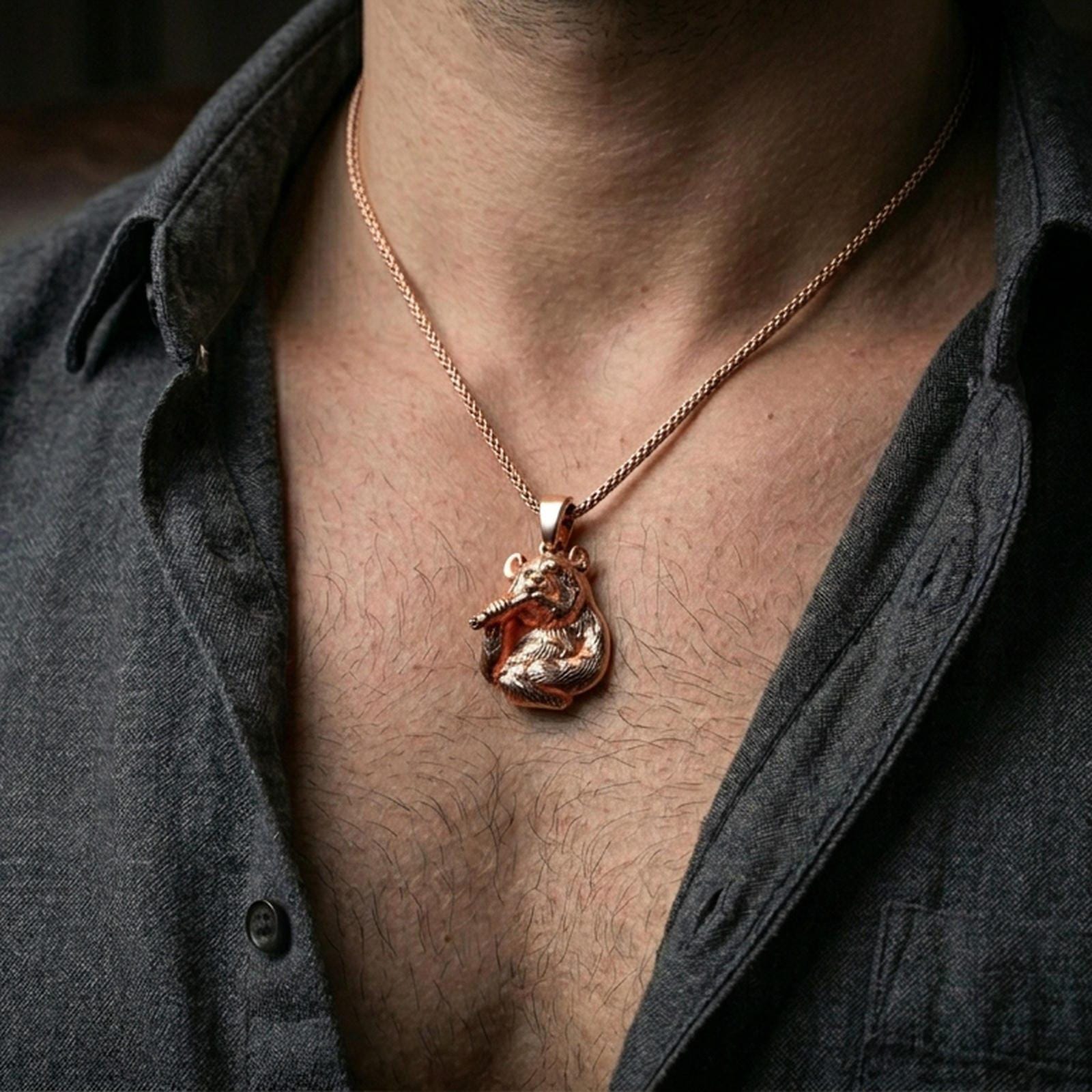 Rose gold plated panda necklace with detailed fur texture and playful bamboo design worn on the neck in a refined lifestyle shot with a warm and elegant presentation