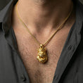Load image into Gallery viewer, Gold plated gorilla king pendant with roaring ape face, regal crown, and strong statement design worn on the neck in a premium lifestyle composition with bold animal-inspired jewelry styling
