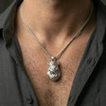 Load image into Gallery viewer, Polished silver crowned gorilla necklace with sculpted fur detail and fierce animal expression worn on the neck in a close lifestyle frame, highlighting the powerful primate motif
