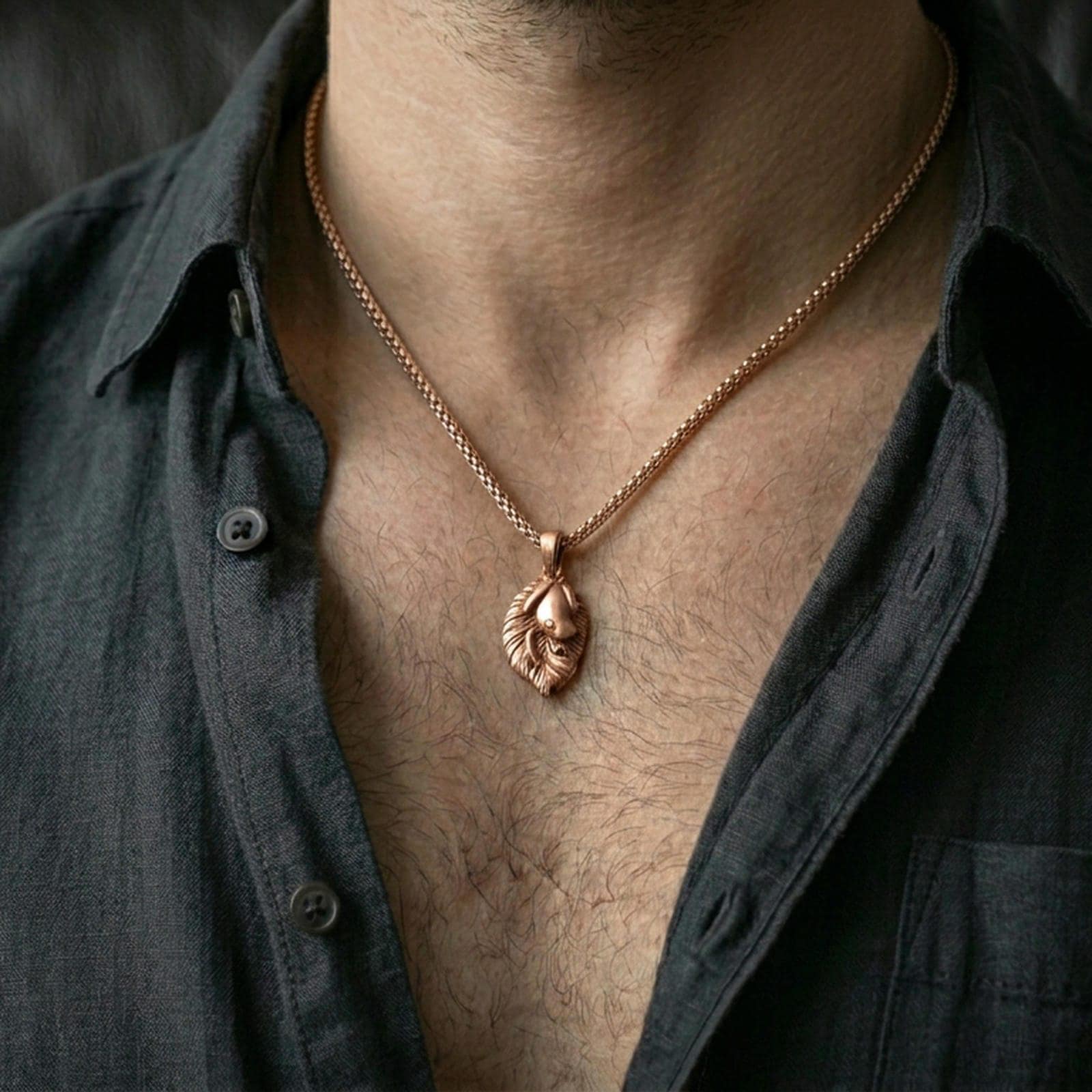 Rose gold plated frog necklace with detailed frog relief, leaf backing, and graceful natural form worn on the neck in a refined lifestyle shot with a warm and sophisticated presentation
